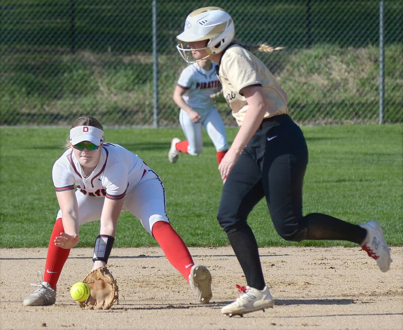 Ottawa’s Piper Lewis fields a ground ball at shortstop as Sycamore’s Riley Schuller looks to advance to third Wednesday at Ottawa.