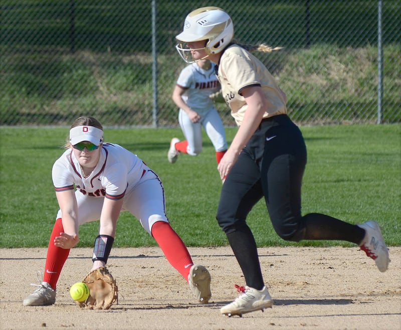 Ottawa’s Piper Lewis fields a ground ball at shortstop as Sycamore’s Riley Schuller looks to advance to third Wednesday at Ottawa.