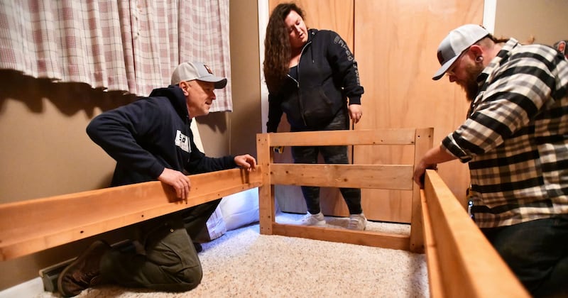 Kankakee Area Sleep in Heavenly Peace chapter president Tim Zydek, left, and volunteers Brandon Collins, right, and Nicole Elliot assembling a bed for a child in 2023. The Watseka chapter of Sleep in Heavenly Peace will hold a bed build on Saturday in Watseka.