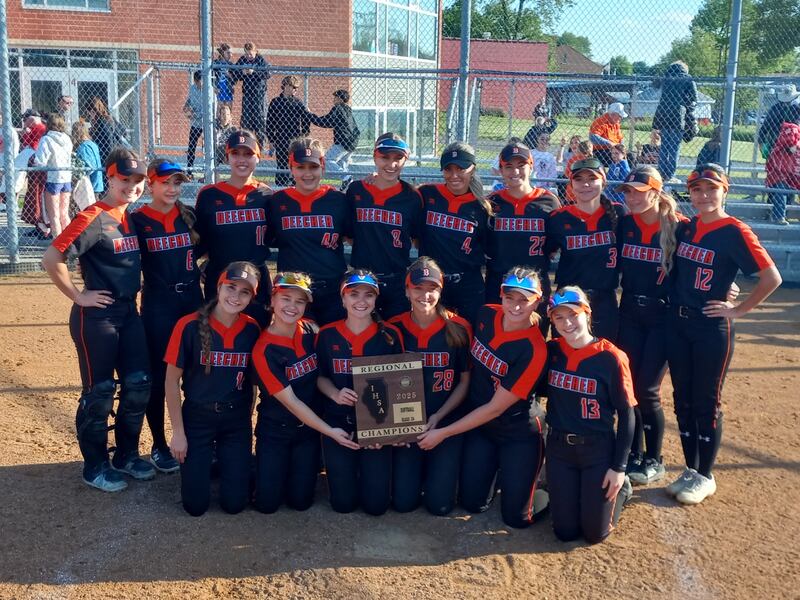 The Beecher softball team poses with their plaque after beating Wilmington 3-1 in the IHSA Class 2A Beecher Regional championship game on May 23, 2025.