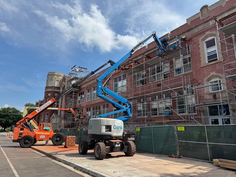 Construction crews work on the masonry along the south side of LTHS Central Campus in July 2025.