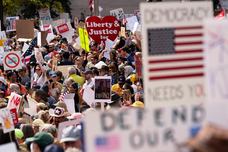 FILE - Demonstrators rally on Pennsylvania Avenue during a No Kings protest in Washington, Oct. 18, 2025. (AP Photo/Jose Luis Magana, File)