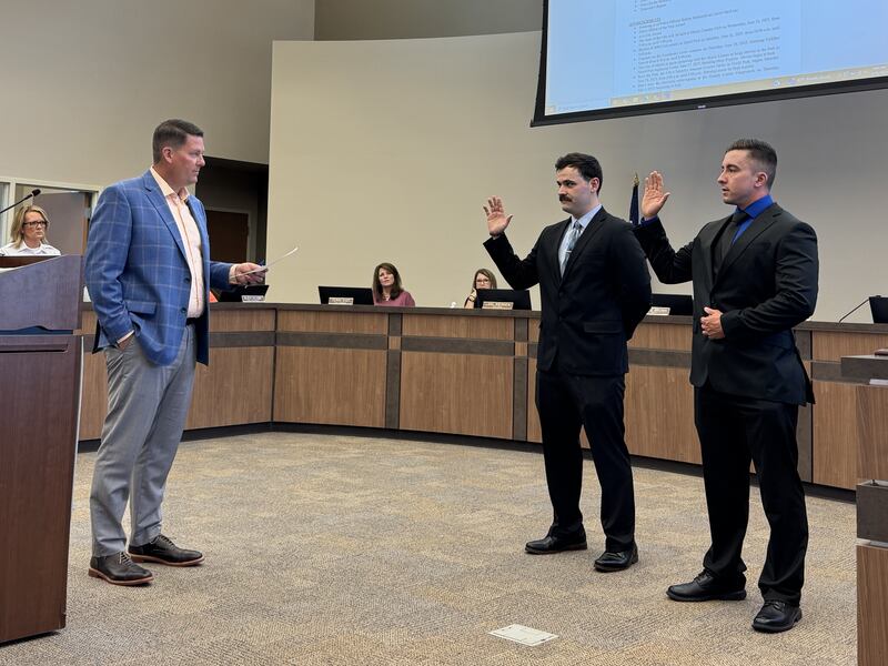 Morris Mayor Chris Brown (left) swears in Officers Kolton Stockwell and Jacob MacLean during the Monday, June 16, 2025 City Council meeting.