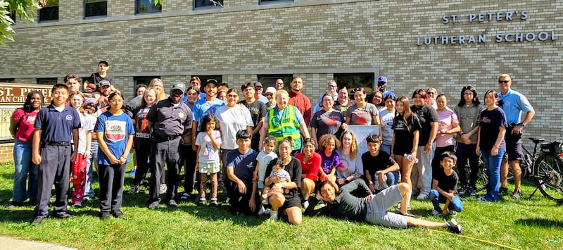 Volunteers for the fall 2025 Bicentennial Bluffs Neighborhood Association neighborhood cleanup pose for a photo at the event's conclusion. Volunteers are needed for the spring event, which will take place Saturday, May 2, 2026.