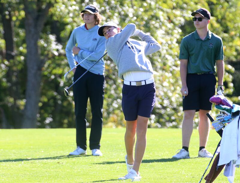Fieldcrest's Carter Senko tees off on the second hole as Midland's Ben Kovach, Henry-Senachwine's Carson Rowe watches during the Class 1A golf meet on Wednesday, Oct. 2, 2024 at Spring Creek Golf Course in Spring Valley.