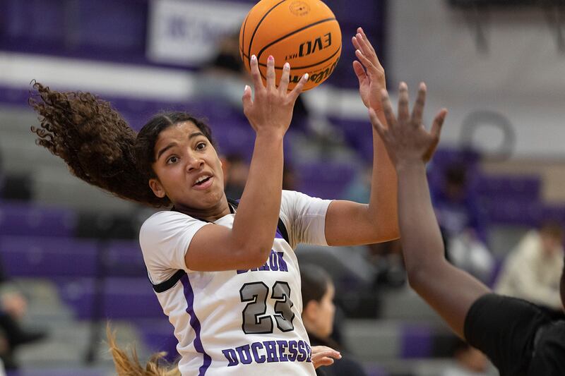 Dixon’s Ahmyrie McGowan takes a pass against Kaneland Wednesday, Dec. 10, 2025.
