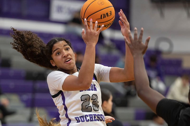 Dixon’s Ahmyrie McGowan takes a pass against Kaneland Wednesday, Dec. 10, 2025.