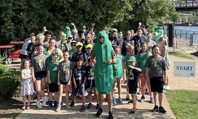 Runners pose at the starting line before the Dill Dash race began at the second annual Pickle Paradise festival at Pottawatomie Park in St. Charles on June 20, 2025.