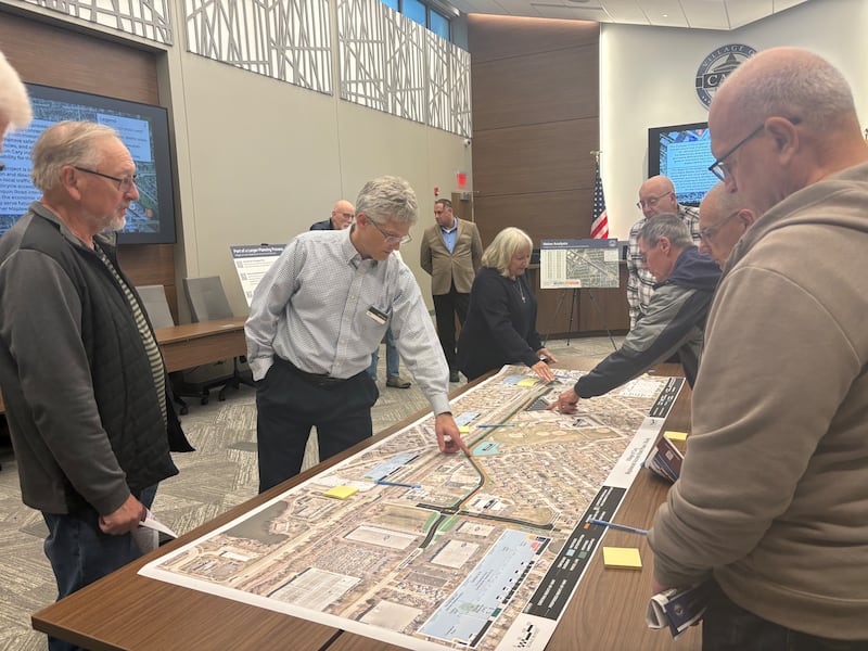 HDR transportation engineer Jeff Young explains the Maplewood Access Road extension project plans with Cary residents on Oct. 15, 2025.