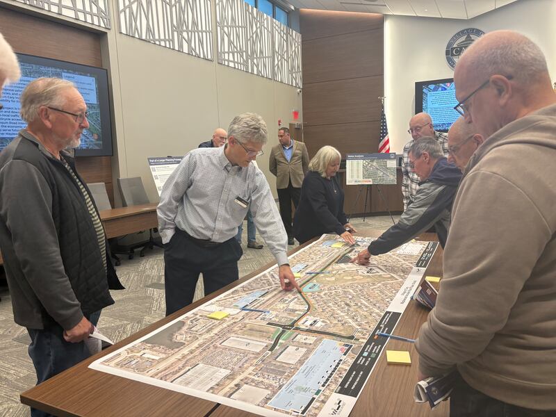 HDR transportation engineer Jeff Young explains the Maplewood Access Road extension project plans with Cary residents on Oct. 15, 2025.