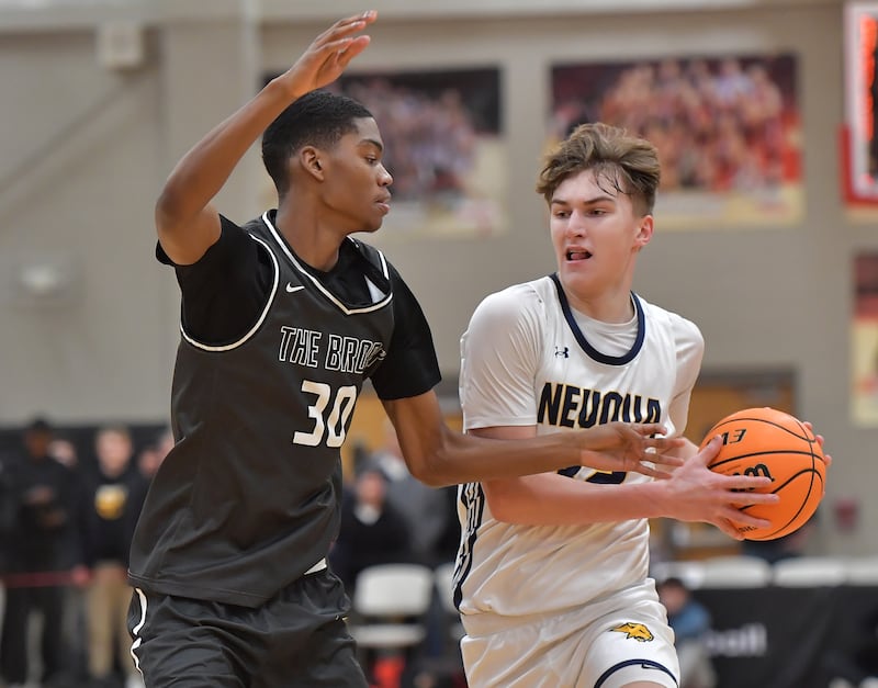 Bolingbrook’s Jayden Madden (30) defends against Neuqua Valley’s Cole Kelly during a When Sides Collide Shootout game on January 24, 2026 at Benet Academy in Lisle.