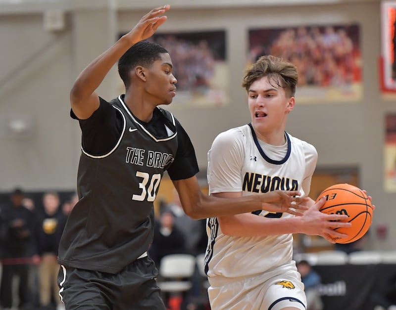 Bolingbrook’s Jayden Madden (30) defends against Neuqua Valley’s Cole Kelly during a When Sides Collide Shootout game on January 24, 2026 at Benet Academy in Lisle.