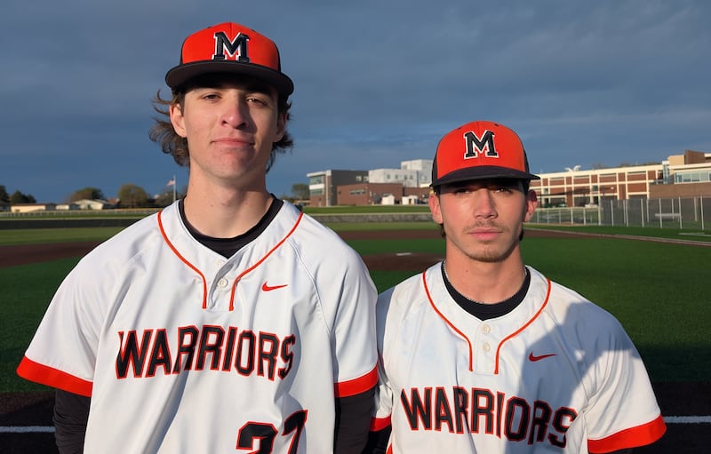 Bennet Baumann (left) and Nathan Neidhardt pose for a picture after they helped McHenry beat Jacobs 8-3 in a Fox Valley Conference baseball game Monday, April 20, 2026, in McHenry.