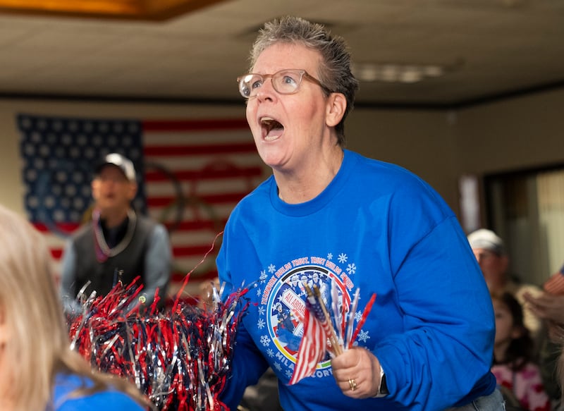 Linda Ray of Barrington, cheers on her nephew and Glen Ellyn native Ethan Cepuran as he competes in the Men's Speed Skating Team Pursuit Quarter Finals during a special watch party on Sunday, February 15, 2026 at the Glen Ellyn Historical Society in Glen Ellyn for local Olympic speed skaters competing in the Milano Cortina Winter Olympics in Italy. Sarah Warren of Willowbrook also competed in the Women's 500 meter Speed Skating finals.