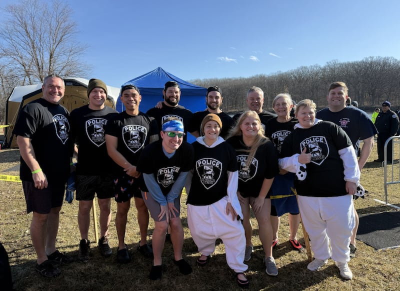 The St. Charles Police, Fire, and Friends team prepares to dive into the icy waters of Ferson Creek Park in St. Charles to fundraise for the Special Olympics Illinois on March 8, 2026.