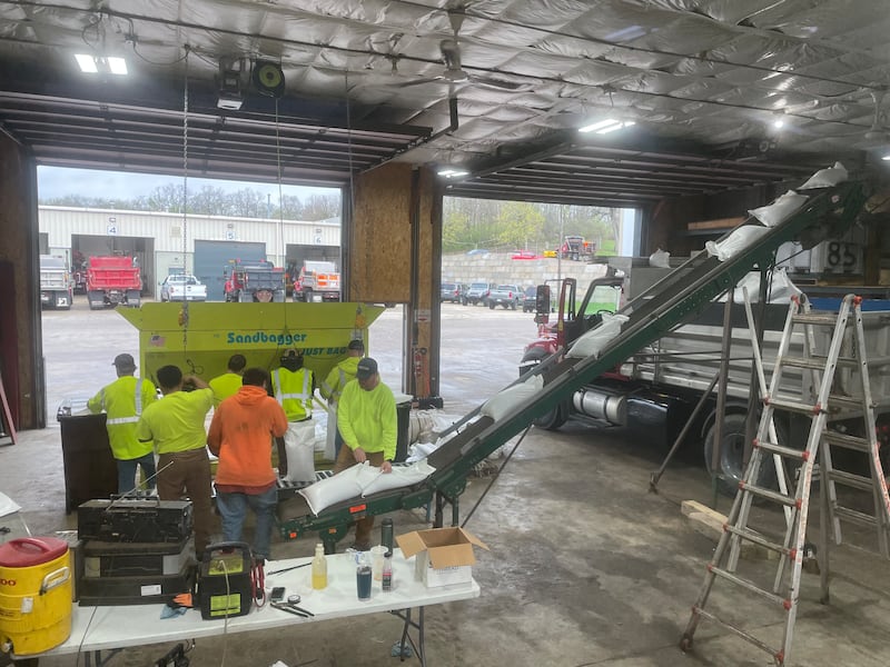 Crews and volunteers fill sandbags on Thursday, April 16, 2026., at the Nunda Township Highway District. Sandbagging along parts of the Fox River began overnight, officials said.