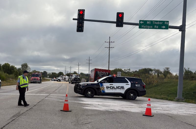 Crews work the scene of a crash that caused a truck to overturn and spill its load on Sept. 24, 2025, along Route 176, causing the road to shut down.