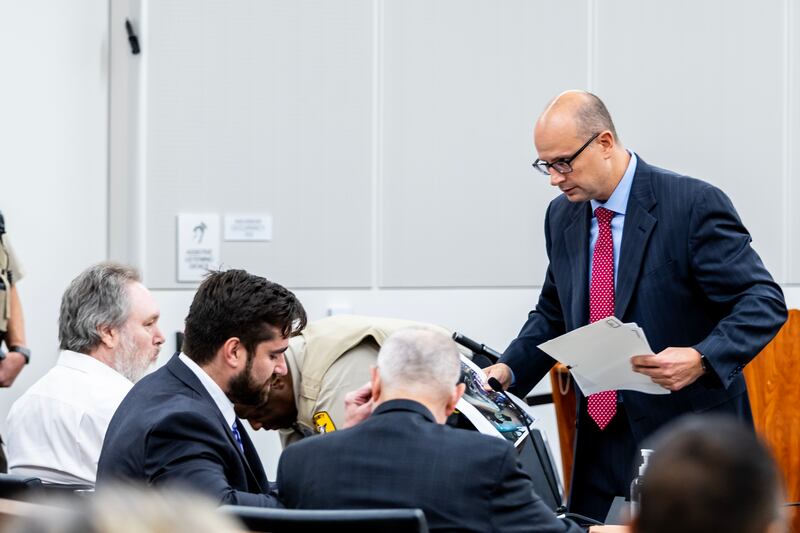 Jim Long, Will County Assistant State's Attorney has a conversation with the defense during the trial of Patrick Gleason at the Will County Courthouse on Sept. 24, 2025.