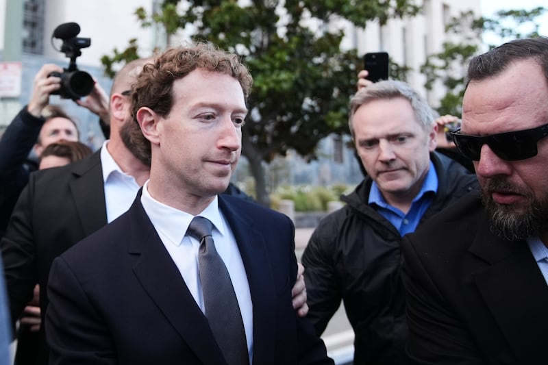 Meta CEO Mark Zuckerberg leaves after testifying in a landmark trial over whether social media platforms deliberately addict and harm children, Wednesday, Feb. 18, 2026, in Los Angeles. (AP Photo/Damian Dovarganes)