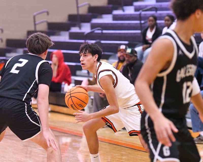 DeKalb's Aaron Ziga (2) looks for an open teammate during the game against Galesburg on Monday Dec. 29, 2025, during the Dayton Invite held at DeKalb High School.