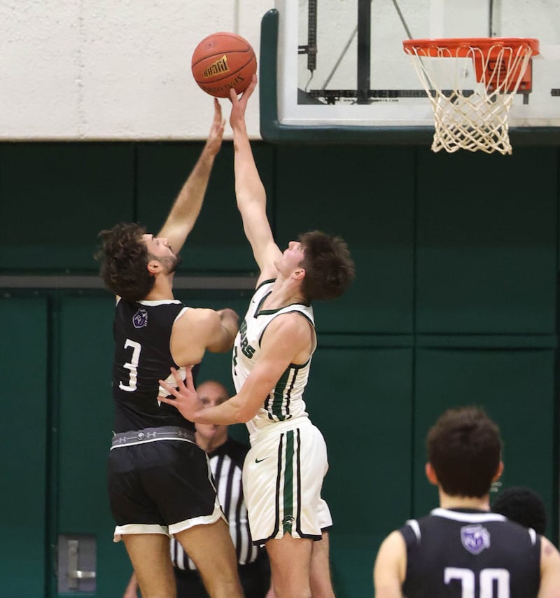 Kishwaukee College's Ben Larry blocks the shot of Rockford University's Ryan Bella Thursday, Jan. 22, 2026, during their game at Kishwaukee College in Malta.