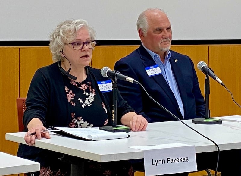 Lynn Fazekas (left), former DeKalb City Clerk, speaks at a candidate forum for the DeKalb City Clerk's race as opponent Bradley Hoey listens on Sunday, March 9, 2025, at the DeKalb Public Library, 309 Oak St. Fazekas and Hoey are running as write-in candidates for the clerk's office in the April 1, 2025, election.