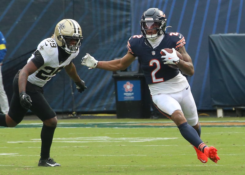Chicago Bears wide receiver DJ Moore runs outside of New Orleans Saints cornerback Quincy Riley on Sunday, Oct .11, 2025 at Soldier Field in Chicago.