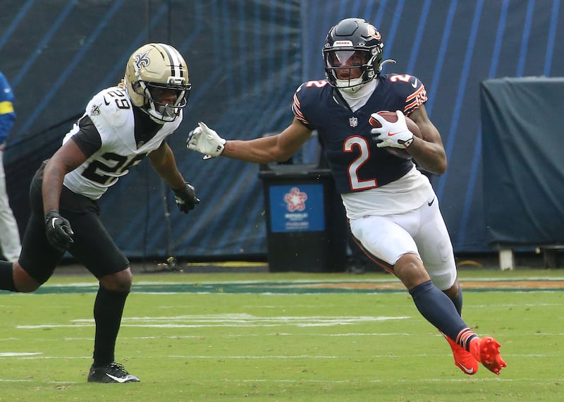 Chicago Bears wide receiver DJ Moore runs outside of New Orleans Saints cornerback Quincy Riley on Sunday, Oct .11, 2025 at Soldier Field in Chicago.