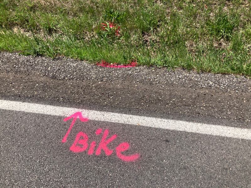 Markings from a police investigation remain on a roadway on July 3, 2025, near Crystal Lake where a 15-year-old boy was fatally hit by a car the night before. Police said the driver fled the scene.
