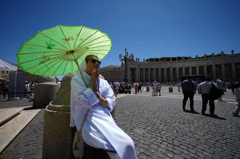 Faithful gather in St. Peter's Square at the Vatican waiting for Pope Leo XIV to appear at his studio's window, Sunday. (AP Photo/Andrew Medichini)