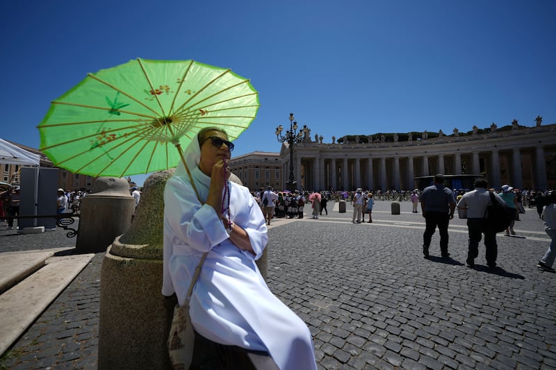 Faithful gather in St. Peter's Square at the Vatican waiting for Pope Leo XIV to appear at his studio's window, Sunday. (AP Photo/Andrew Medichini)