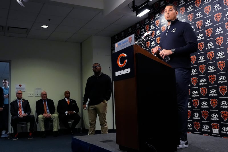 Chicago Bears General Manager Ryan Poles, right, listens to reporters during an NFL football news conference at Halas Hall in Lake Forest, Ill., Tuesday, Jan. 7, 2025. (AP Photo/Nam Y. Huh)
