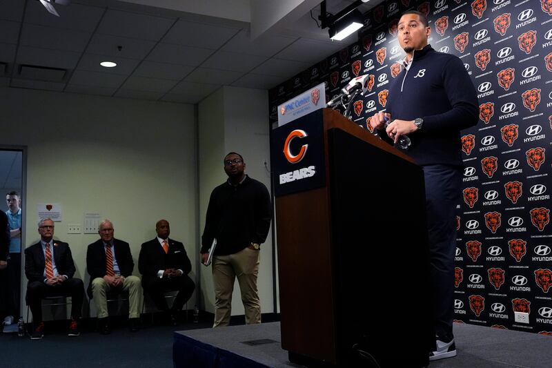 Chicago Bears General Manager Ryan Poles, right, listens to reporters during an NFL football news conference at Halas Hall in Lake Forest, Ill., Tuesday, Jan. 7, 2025. (AP Photo/Nam Y. Huh)