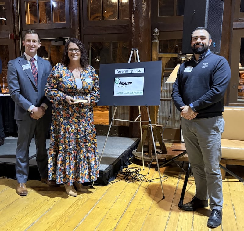 IVAC Board President Neal Knauf, Phil Lopez of Ameren, and Laura Butterfield pose after Butterfield received the Volunteer of the Year award at the Illinois Valley Area Chamber of Commerce annual dinner Wednesday.