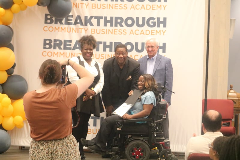 Caprisha Williams receives her diploma Monday, June 2, 2025, during the graduation ceremony for the Breakthrough Community Business Academy's spring 2025 cohort.