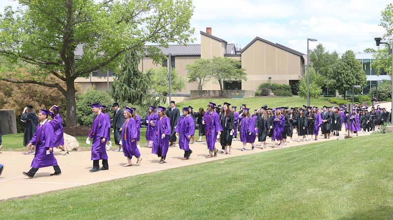 Illinois Valley Community College graduates walk in procession as they enter the gymnasium during the 59th annual Commencement Ceremony on Saturday, May 17, 2025 at IVCC.
