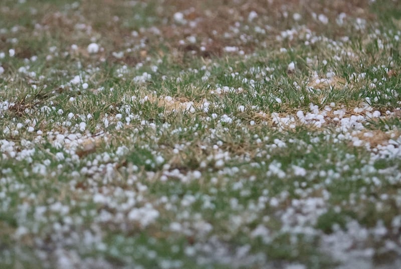 Hail covers grass on a lawn on Tuesday, March 10, 2026 in Princeton.