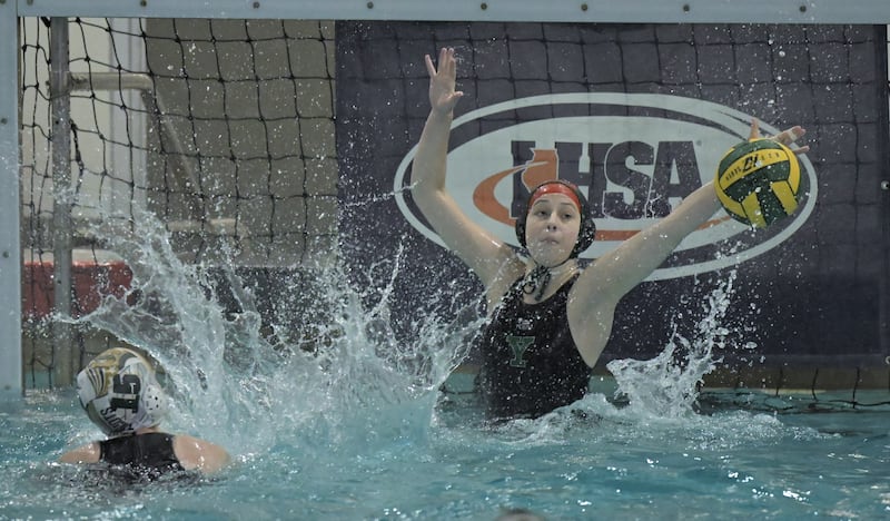 Stevenson’s Shanee Sheinman scores against York’s Caroline Lemeka at the IHSA Girls State Water Polo Championship in Barrington on Saturday, May 23, 2026.