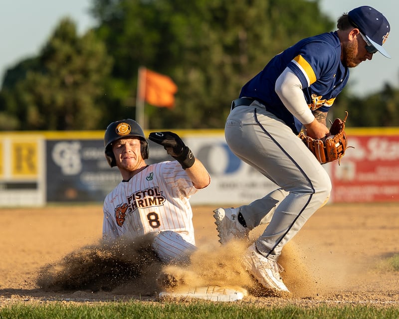 Brayden Foster (8) of the Pistol Shrimp slides into third base, successfully stealing as Springfield's third baseman Ethan Burkhardt (15) holds ball in glove on Tuesday, June 3, 2026, at Schweickert Stadium in Peru.