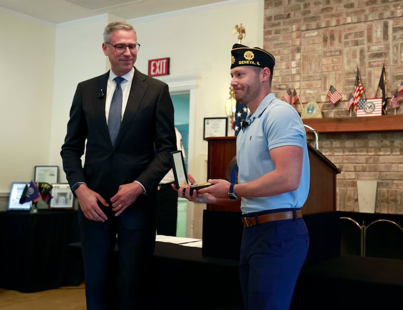 Illinois Treasurer Michael Frerichs, left, returned a lost Purple Heart medal Thursday, June 12, 2025 at the American Legion Post 75 in Geneva to the grandson Shawn Gorski, of World War II veteran Private First-Class Edward Gorski Jr. who earned it while fighting to liberate Germany. Shawn also served in the Army.