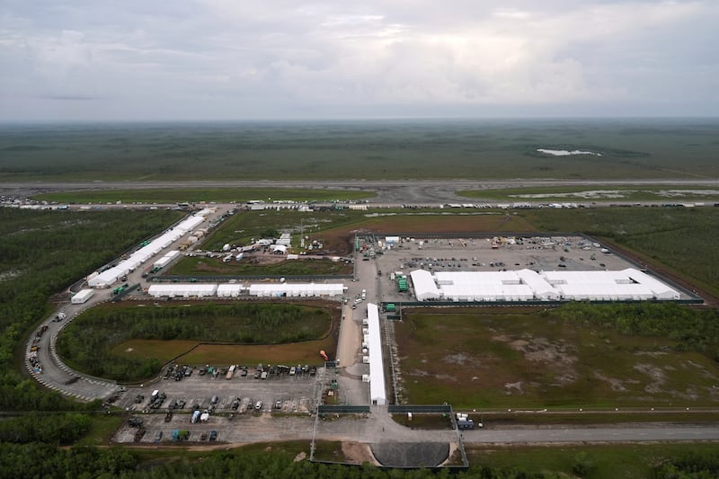 FILE - Work progresses on a new migrant detention facility dubbed "Alligator Alcatraz," at Dade-Collier Training and Transition facility in the Florida Everglades, on July 4, 2025, in Ochopee, Fla. (AP Photo/Rebecca Blackwell, File)