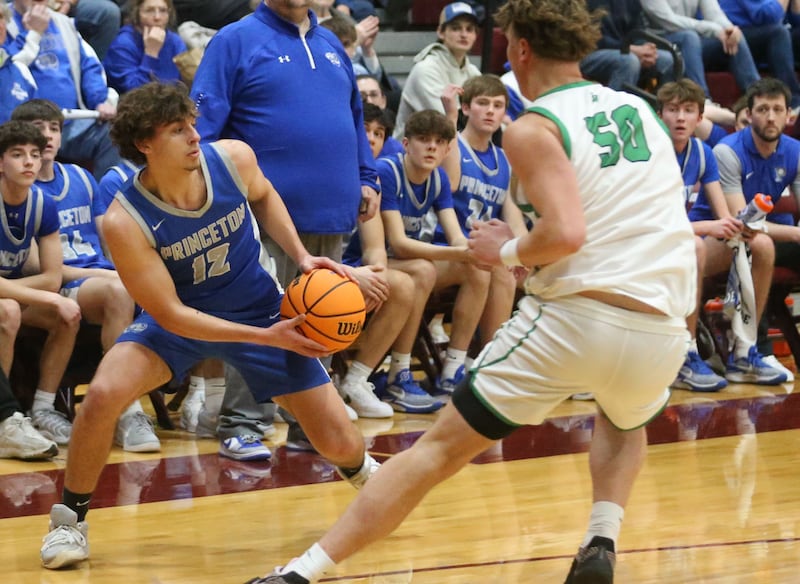 Princeton's Asa Gartin dribbles around Rock Falls's Cole Mulnix during the Class 2A Sectional final on Friday, March 7, 2025 at Marengo High School.