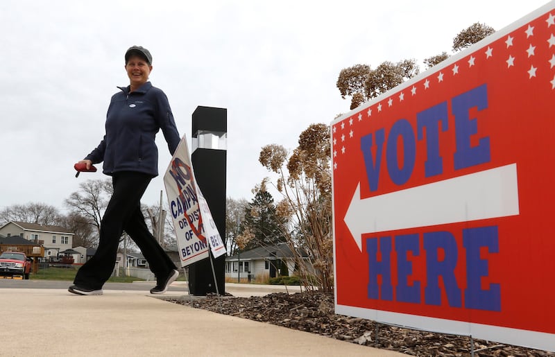 A voter leaves the Johnsburg Village Hall after voting on Tuesday, April 1, 2025, in the 2025 Consolidated Election.