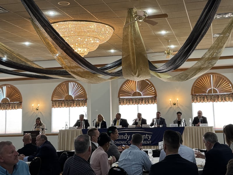 Nancy Norton, President and CEO of the Grundy Economic Development Commission (left), addresses the crowd at the annual GEDC Legislative Breakfast. Also pictures are (from left) 16th District US Rep. Darin LaHood, R-Dunlap, 38th District Ill. Senator Sue Rezin, R-Morris, 40th District Ill. Senator Patrick Joyce,, D-Essex, 53rd District Ill. Senator Chris Balkema, 106th District Ill. Rep. Jason Bunting, R-Dwight, 79th District Ill. Rep. Jackie Haas, R-Kankakee, and 75th District Ill. Rep. Jed Davis, R-Yorkville.