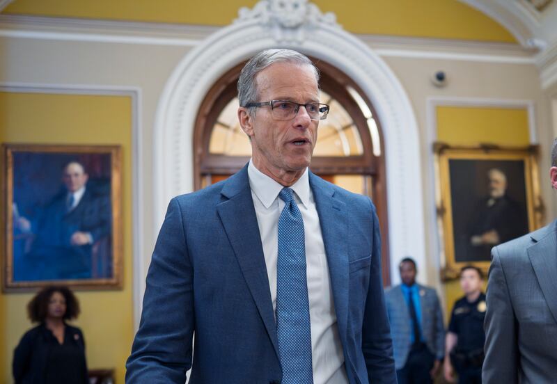 Senate Majority Leader John Thune, R-S.D., rushes from the chamber to his office as he struggles with Republicans opposed to President Donald Trump's signature bill of big tax breaks and spending cuts, at the Capitol in Washington, Tuesday, July 1, 2025. (AP Photo/J. Scott Applewhite)