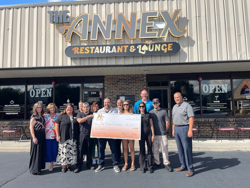 Owners of The Annex Restaurant and Lounge in Lake in the Hills receives the first Algonquin-Lake in Hills Chamber Foundation's ALERT grant after a break-in damages the restaurant's building.