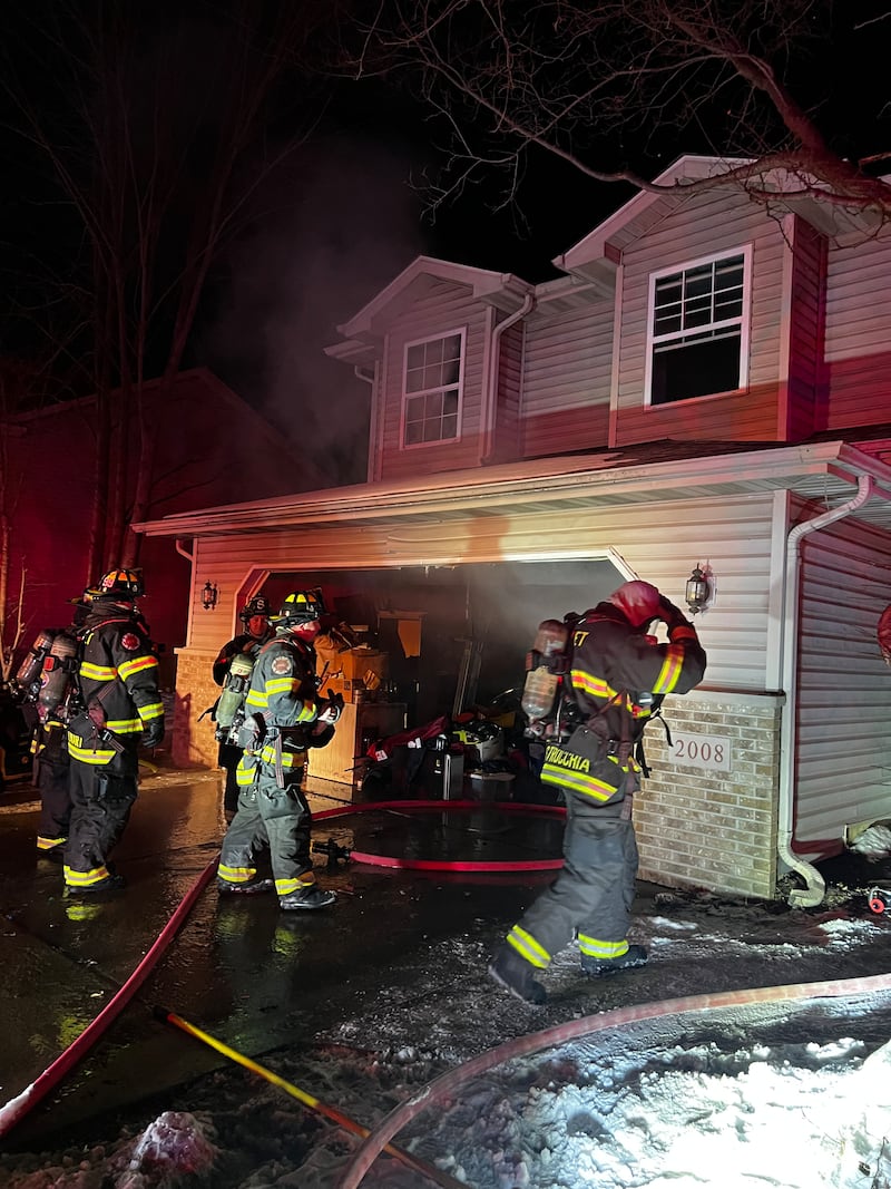 Joliet firefighters at the scene of an early morning house fire in the 2000 block of Addleman Street in Joliet on Sunday, Feb. 1, 2026.