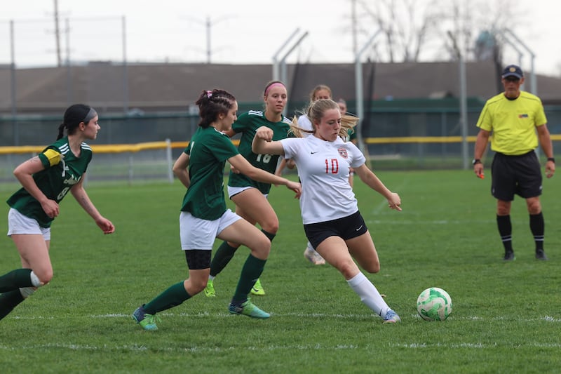Bradley-Bourbonnais' Harper Tollefson takes a shot on goal past Bishop McNamara defenders during the Boilermakers' 9-1 win over Bishop McNamara in All-City play on Tuesday, March 31, 2026.