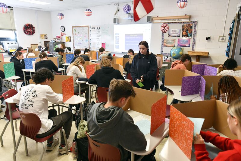 A student maneuvers through desks to turn in a test in March in Mrs. Laurie Januski’s class at Bradley-Bourbonnais Community High School. BBCHS recently announced that it earned a recognition from the College Board for students’ AP achievements in 2023.