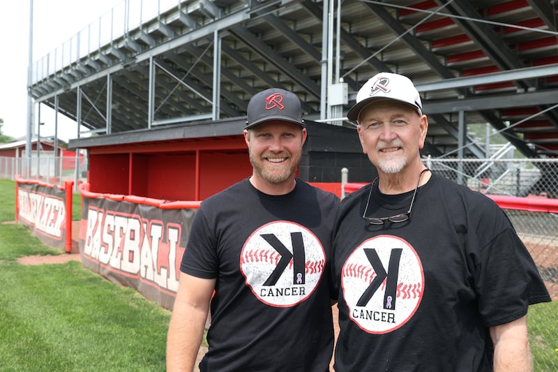 Bradley-Bourbonnais baseball coach Brad Schweigert, left, stands with his father, Keith Schweigert on the field.